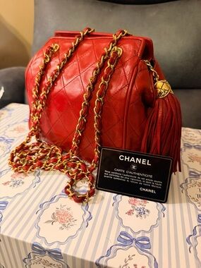 Authentic CHANEL Red Quilted Leather Shoulder Bag with Tassel and Gold Chain